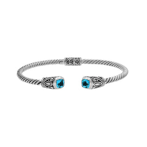 Silver twisted cable bangle in 925 sterling silver with Blue Topaz Quartz ends and Balinese engraving.