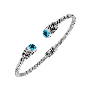 Silver twisted cable bangle in 925 sterling silver with Blue Topaz Quartz ends and Balinese engraving.