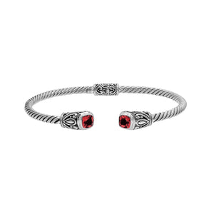 Silver twisted cable bangle in 925 sterling silver with Garnet Quartz ends and Balinese engraving.