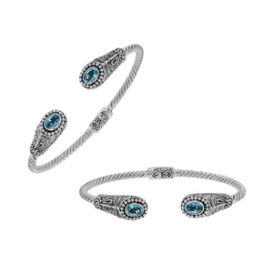Silver twisted cable bangle in 925 sterling silver with Blue Topaz Quartz ends and Balinese engraving.