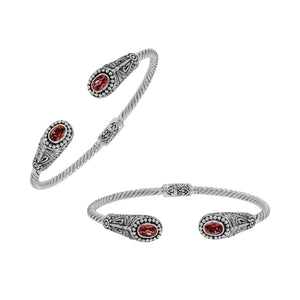 Silver twisted cable bangle in 925 sterling silver with Garnet Quartz ends and Balinese engraving.