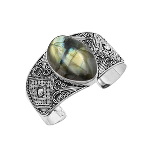 925 sterling silver wide Balinese bangle with Labradorite centerpiece and ornate scroll detailing.