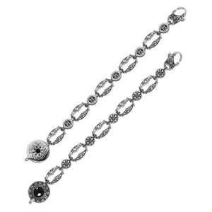 Wholesale sterling silver bracelet featuring ornate Balinese-style links, round Black Onyx center detailing, antique oxidized accents, and a secure lobster lock for catalog-ready presentation.