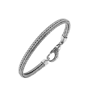 A beautifully crafted sterling silver woven bracelet with a secure lobster clasp, featuring intricate chain detailing and a mirror-polished high-gloss finish for elegant collections.