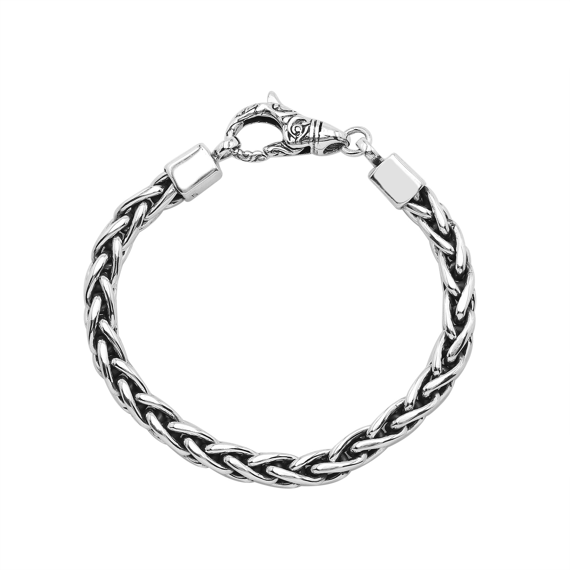 Wholesale sterling silver bracelet featuring a braided chain and decorative lobster clasp handcrafted in Bali.