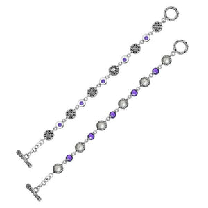 Wholesale sterling silver bracelet featuring alternating Mabe Pearl and Amethyst quartz gemstones in decorative round links with oxidized detailing and a secure toggle lock closure.