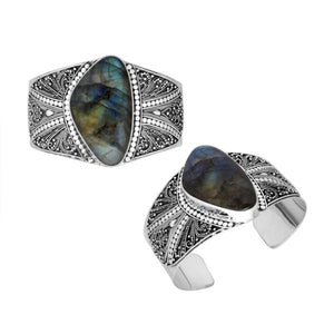 Wholesale sterling silver cuff bracelet featuring a large labradorite stone surrounded by detailed Bali filigree patterns, crafted for premium bulk jewelry selections.