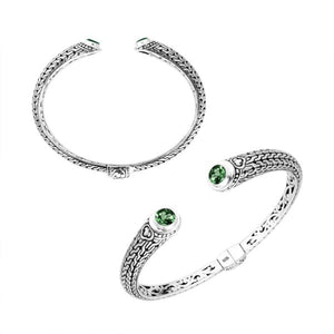 Wholesale sterling silver Bali engraved hinge cuff bracelet featuring vivid green quartz accents and polished–oxidized detailing, crafted for premium wholesale jewelry collections and artistic bulk assortments.