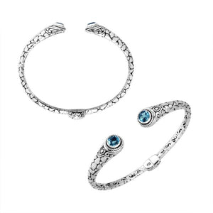 Wholesale sterling silver Bali engraved hinge cuff bracelet featuring polished–oxidized detailing and radiant blue topaz quartz ends, expertly crafted for refined contemporary wholesale jewelry assortments