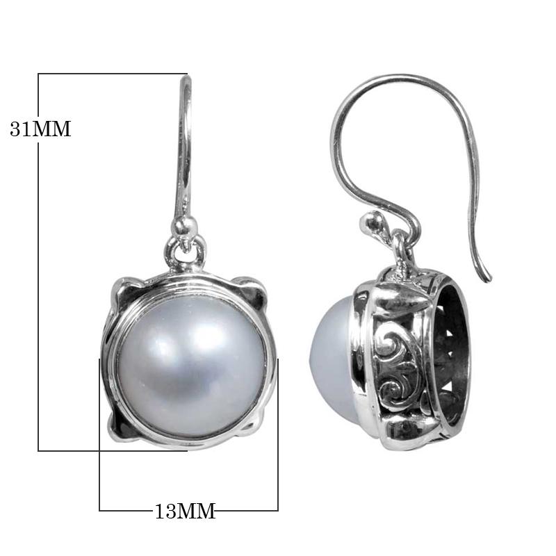 Wholesale sterling silver earrings with round white pearl and Bali-style handcrafted design.