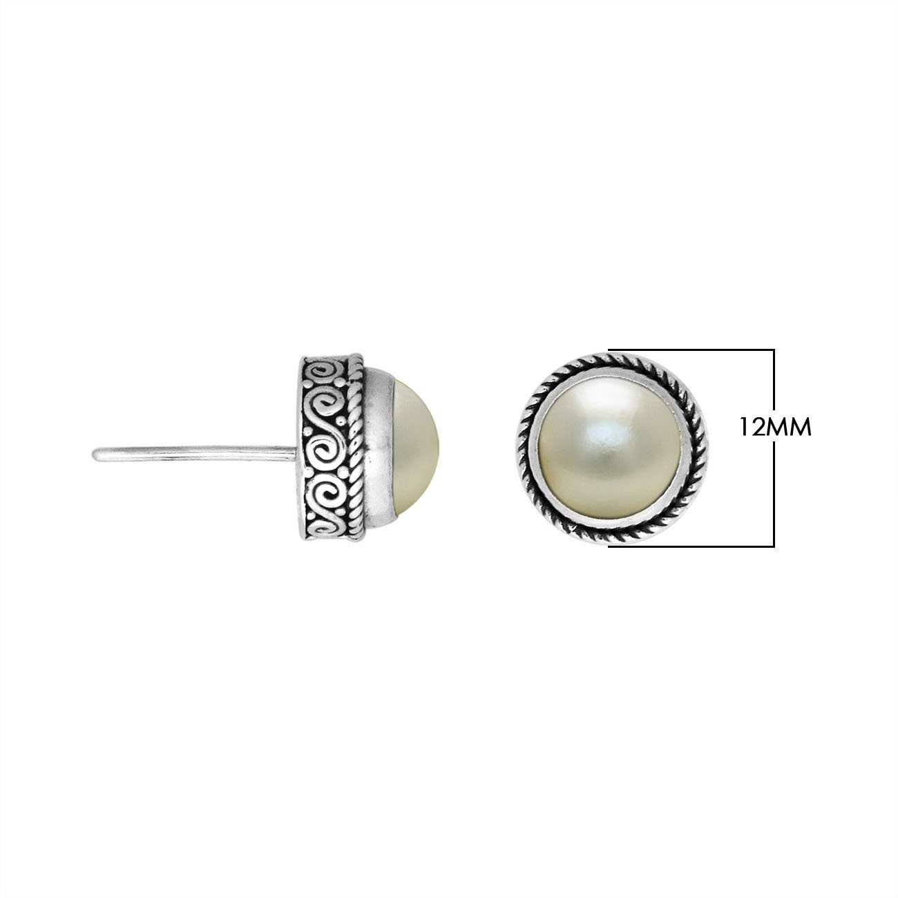 Sterling silver stud earrings with White Pearls and Balinese swirl detailing.