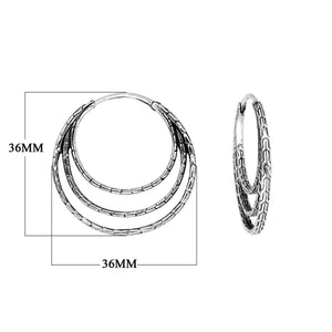 Sterling Silver Triple Hoop Earrings featuring layered circular design and detailed texture with latch back for secure wear