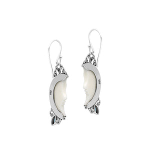 Sterling silver lunar bone face earrings with blue topaz quartz accent and earwire lock