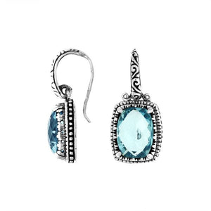 Wholesale sterling silver earrings with rectangular Blue Topaz Quartz and handcrafted metal details.