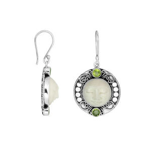 Wholesale sterling silver earrings with carved bone face and Peridot Quartz accents.