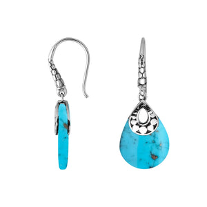 Wholesale-ready sterling silver earrings featuring Turquoise Shell drops set in a structured polished teardrop frame.