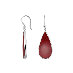 Wholesale sterling silver earrings with Red Coral teardrops set in polished bezel frames.