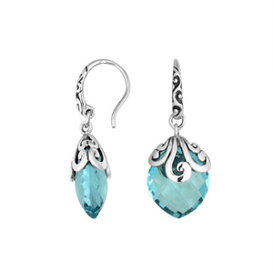 Sterling silver Blue Topaz Quartz earrings with faceted teardrop design and ornate silver scrollwork for wholesale collection.