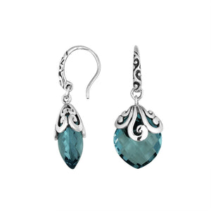 Sterling silver London Blue Topaz Quartz earrings with faceted teardrop design and ornate silver scrollwork for wholesale collection.