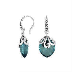 Sterling silver London Blue Topaz Quartz earrings with faceted teardrop design and ornate silver scrollwork for wholesale collection.