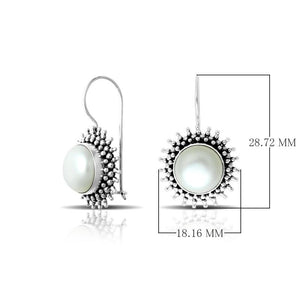 Wholesale sterling silver Bali granulated earrings featuring luminous mabe pearl centers with polished–oxidized detailing, crafted to enhance luxury artisan-focused wholesale jewelry collections.
