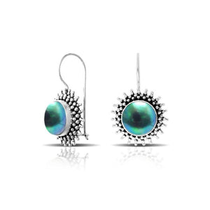 Green Mabe Pearl sterling silver artisan earrings featuring a sunburst textured frame with polished earwire hooks, designed as handcrafted statement dangle jewelry.
