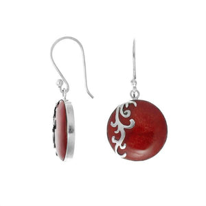 Wholesale sterling silver earrings featuring round red coral drops with a polished wave-motif overlay, crafted to provide consistent artisan quality and elegant catalog-ready presentation for bulk jewelry buyers.