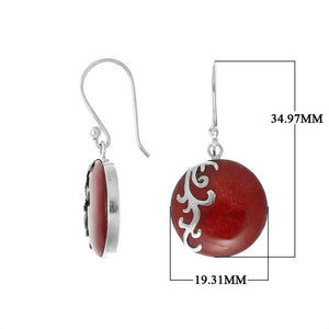 Wholesale sterling silver earrings featuring round red coral drops with a polished wave-motif overlay, crafted to provide consistent artisan quality and elegant catalog-ready presentation for bulk jewelry buyers.