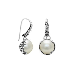 Wholesale sterling silver earrings featuring luminous Mabe pearls set in ornate Balinese-style silver detailing, crafted to deliver consistent artisan quality and an elegant catalog-ready presentation for wholesale jewelry buyers.