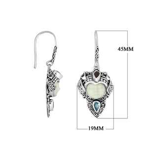 Wholesale sterling silver earrings featuring a carved Bone Face centerpiece adorned with Blue Topaz Quartz and Garnet Quartz accents, designed with ornate Balinese detailing for consistent artisan presentation.