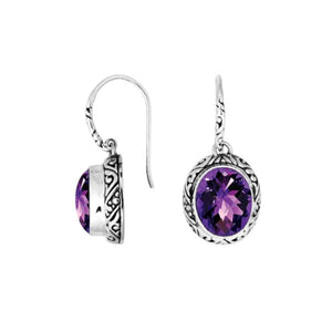 Wholesale sterling silver earrings featuring a faceted oval Amethyst Quartz stone framed with detailed carved silver accents and earwire lock, offering a vibrant artisan look ideal for premium jewelry catalogs.
