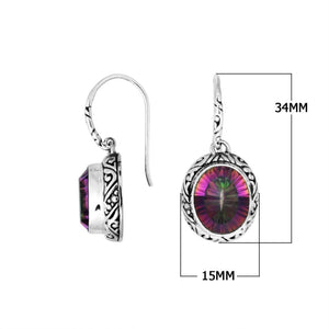 Wholesale sterling silver earrings featuring an oval Mystic Topaz Quartz stone with multicolor brilliance, framed in carved silver detailing and secured with an earwire lock for premium artisan presentation.