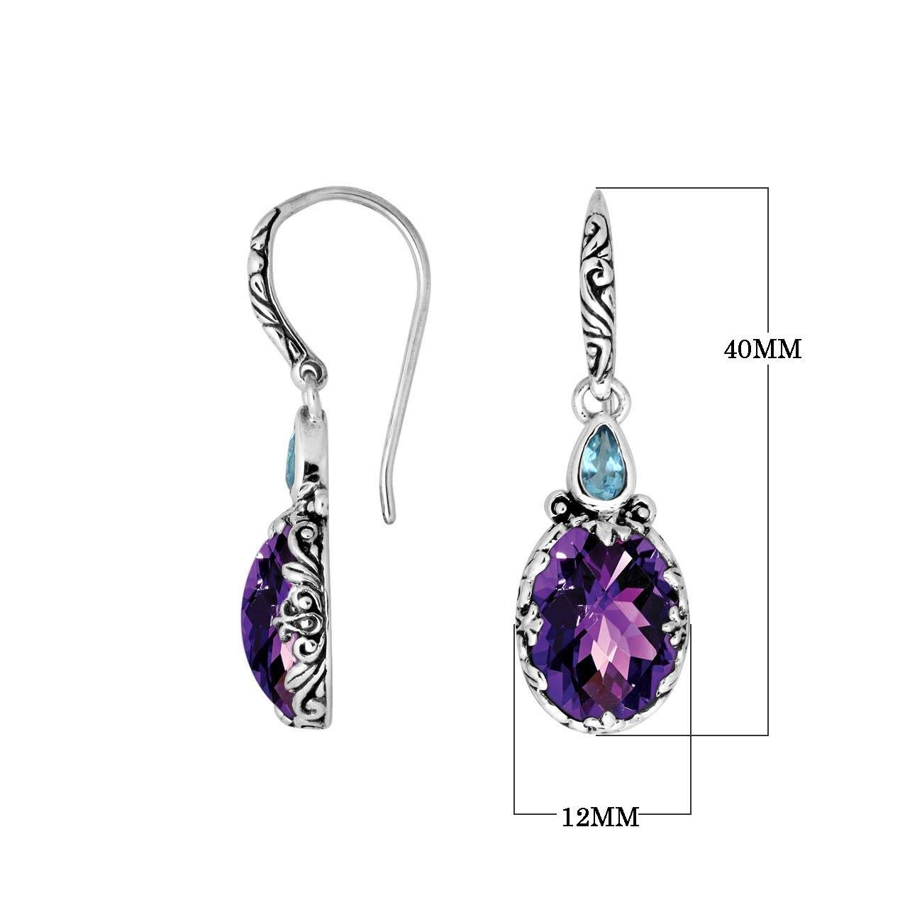 Wholesale sterling silver earrings featuring a dual-stone design with vibrant Amethyst Quartz and bright Blue Topaz Quartz, framed in ornate carved detailing with earwire lock for premium catalog-ready presentation.