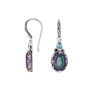 Wholesale sterling silver earrings featuring a prismatic Mystic Quartz centerpiece paired with a bright Blue Topaz Quartz accent, framed in ornate carved silver with an earwire lock for vibrant premium wholesale presentation.