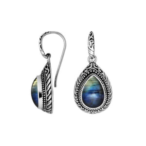 Wholesale sterling silver Labradorite teardrop earwire earrings featuring carved silver borders, decorative bead accents, antique-polished finish, and handcrafted detailing designed for premium jewelry collections.