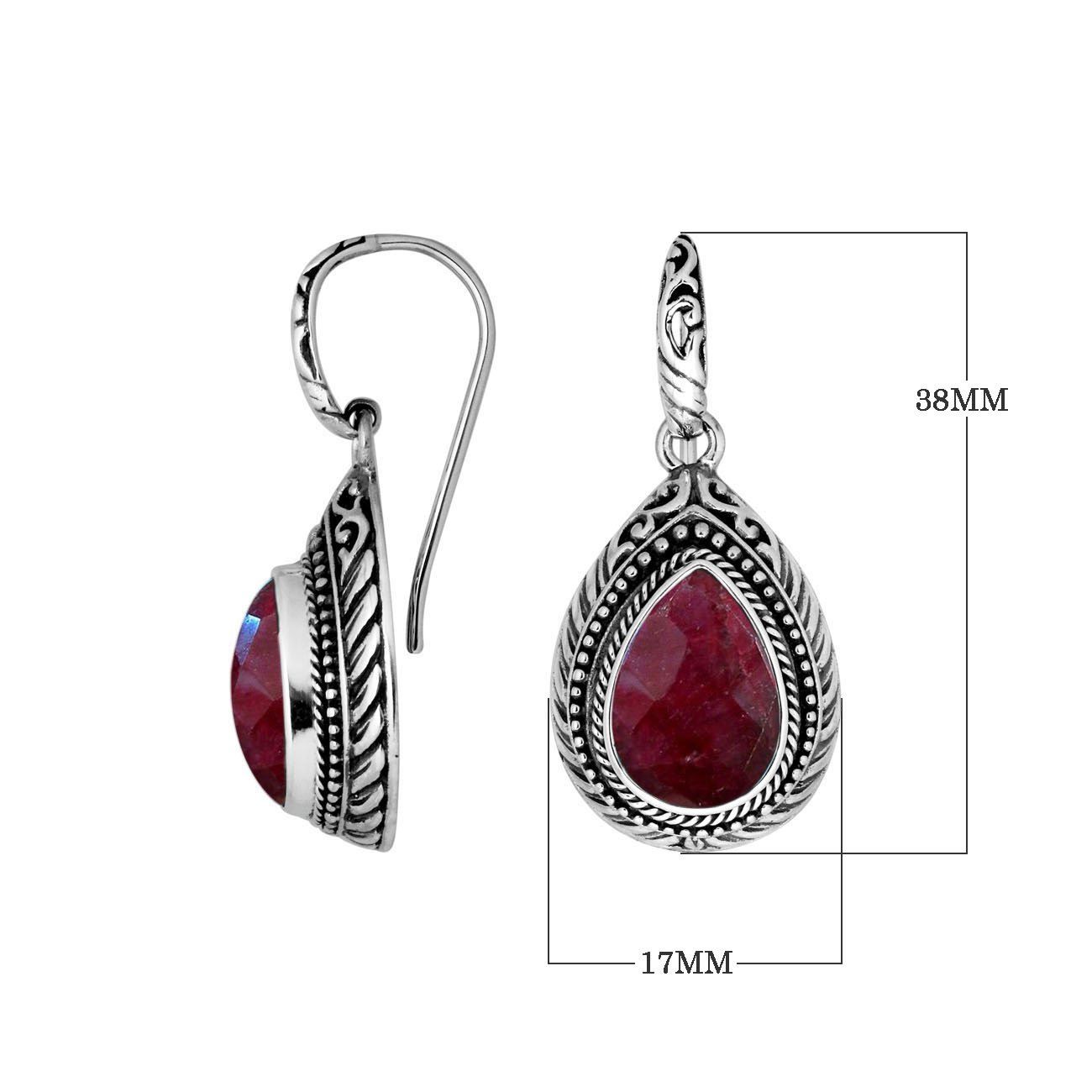 Wholesale sterling silver Ruby Quartz teardrop earwire earrings featuring intricately carved silver borders, decorative bead accents, antique-polished finish, and handcrafted detailing for premium boutique jewelry collections.