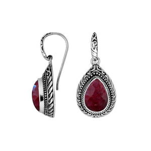 Wholesale sterling silver Ruby Quartz teardrop earwire earrings featuring intricately carved silver borders, decorative bead accents, antique-polished finish, and handcrafted detailing for premium boutique jewelry collections.