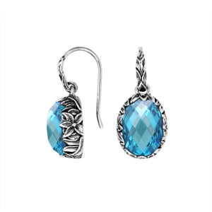 Wholesale sterling silver Blue Topaz Quartz oval earwire earrings featuring floral hand-carved silver detailing, antique-polished finish, secure earwire hooks, and intricate artisan craftsmanship designed for premium wholesale jewelry collections.