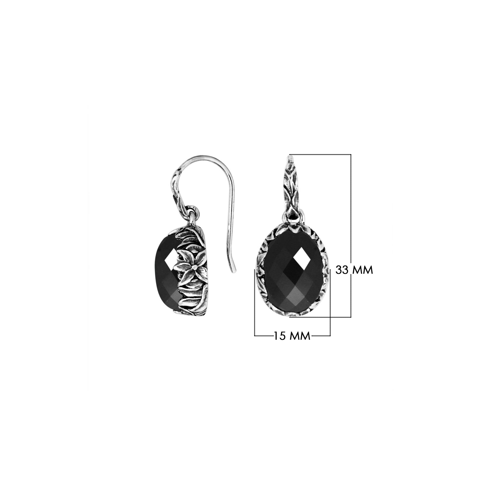 Wholesale sterling silver Black Onyx oval earwire earrings featuring floral hand-carved silver detailing, polished oxidized finish, secure earwire hooks, and bold black stone design created for premium wholesale jewelry collections.