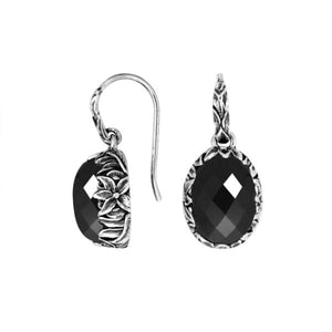 Wholesale sterling silver Black Onyx oval earwire earrings featuring floral hand-carved silver detailing, polished oxidized finish, secure earwire hooks, and bold black stone design created for premium wholesale jewelry collections.