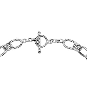 Sterling silver textured rope link chain necklace with toggle clasp.