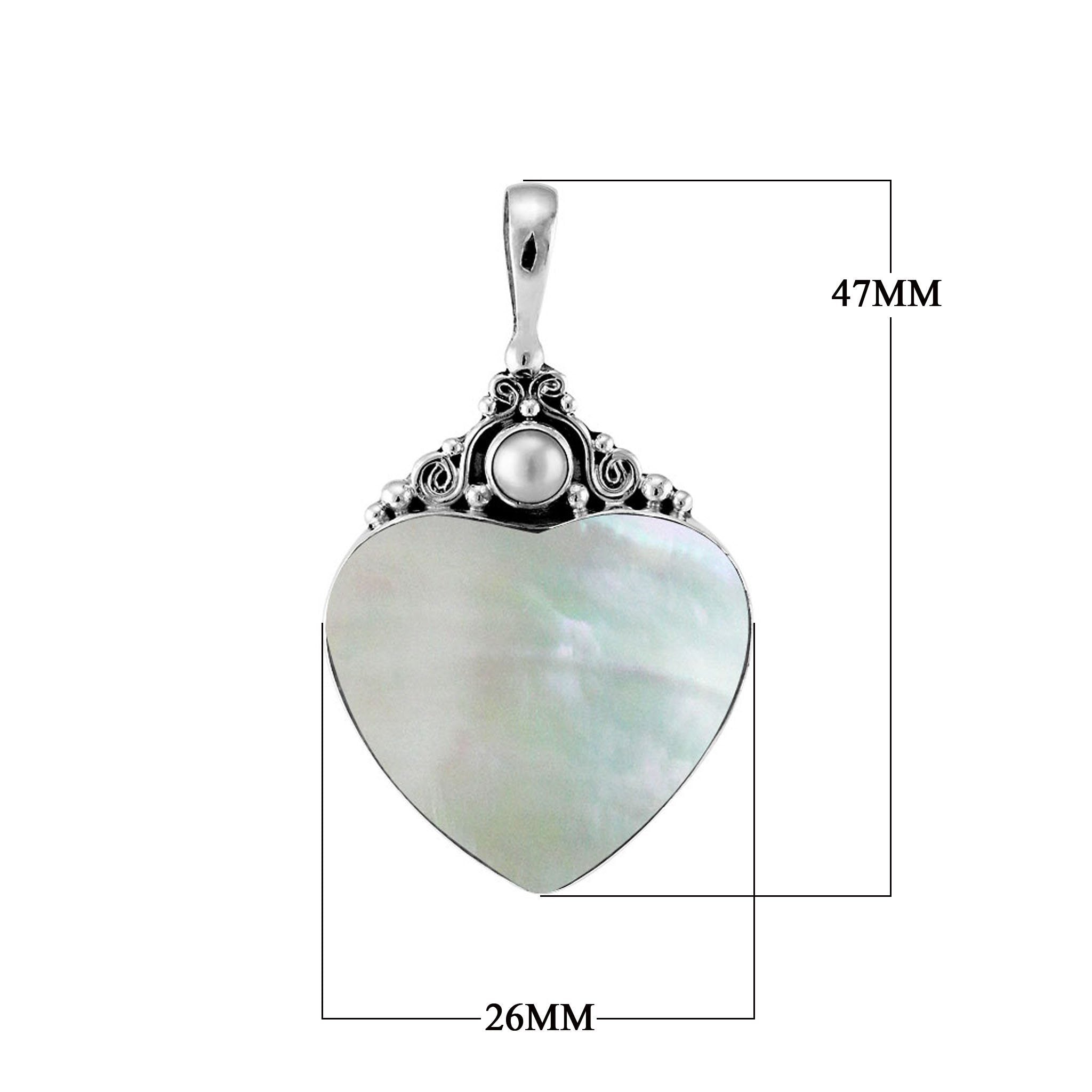 Sterling silver heart pendant with luminous Mother of Pearl centerpiece and artisan scrollwork, handcrafted Bali jewelry available for wholesale purchase.