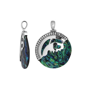 Sterling silver round pendant with vibrant abalone shell inlay and artistic silver overlay, handcrafted Bali jewelry available for wholesale purchase.