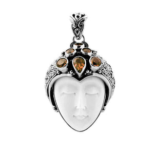 Wholesale sterling silver pendant with hand-carved bone goddess face and faceted citrine gemstones, handcrafted in Bali artisan design.