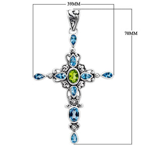 Wholesale sterling silver cross pendant with genuine peridot center stone and blue topaz accents, handcrafted Bali jewelry with ornate detailing for bulk orders.