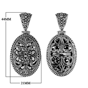 Sterling silver oval pendant with floral scrollwork, handcrafted Bali wholesale jewelry.