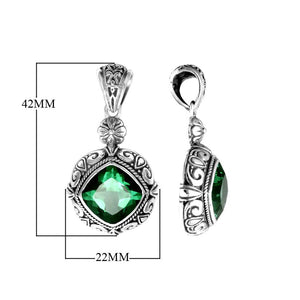 Sterling silver pendant with cushion-cut green quartz, handcrafted in Bali with ornate scrollwork and oxidized finish.