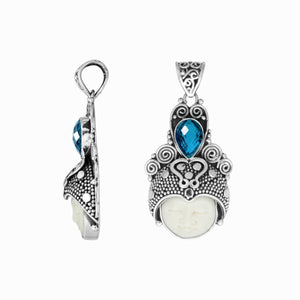 Wholesale bone face pendant with blue topaz quartz in sterling silver, handcrafted in Bali.