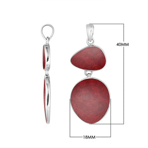 Sterling silver double-shape pendant featuring triangular and oval red coral with smooth high-polish finish in classic Balinese craftsmanship.