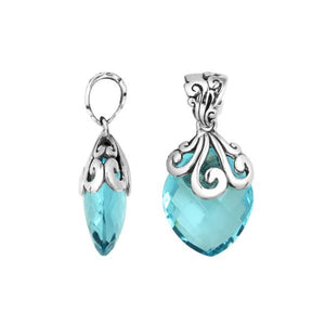 Handcrafted 925 Sterling Silver Blue Topaz Quartz pendant with intricate swirl filigree pattern, mirror-polished surface, and Balinese-inspired marquise shape design for wholesale jewelry suppliers.